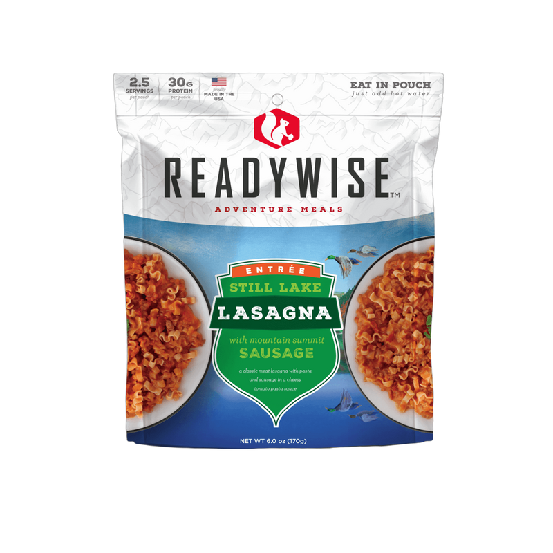 Resealable pouch of ReadyWise Still Lake Lasagna with Sausage meal featuring a mountain-themed label, highlighting 2.5 servings, 30 grams protein, made in USA, ideal for camping, pantry, and emergency supplies.
