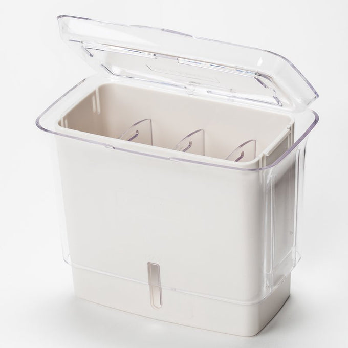 Clear and white fresh-cut herb keeper with removable dividers and refill window, designed to extend herb freshness in kitchen storage and cooking collections.