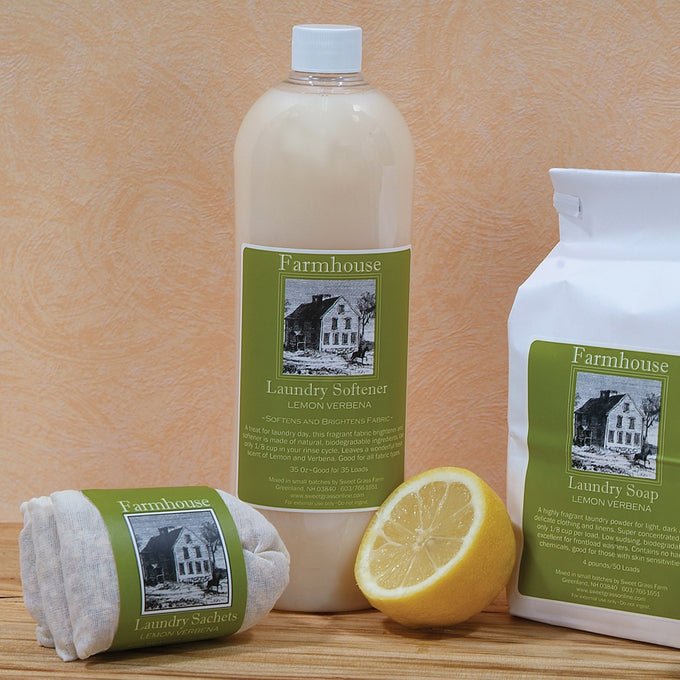 Handcrafted lemon verbena fabric softener, soap, and sachets with a fresh lemon half, displayed against a warm backdrop, ideal for Home & Decor, Laundry Supplies, USA Made, and Best Sellers collections.