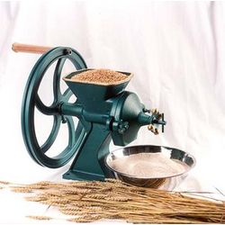 Solid cast iron grain mill with a large wheel and wooden handle, designed for fast, fine grinding of grains, featured in Kitchen & Food, Baking Supplies, and Grain Mills collections.