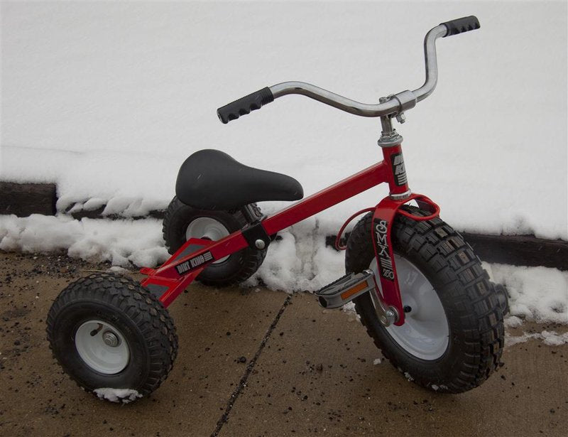 Red sturdy tricycle with heavy-duty knobby tires suitable for snow and rough outdoor terrain, featuring an adjustable seat, designed for durability and all-season play in Children's Toys and Outdoor Play collections.