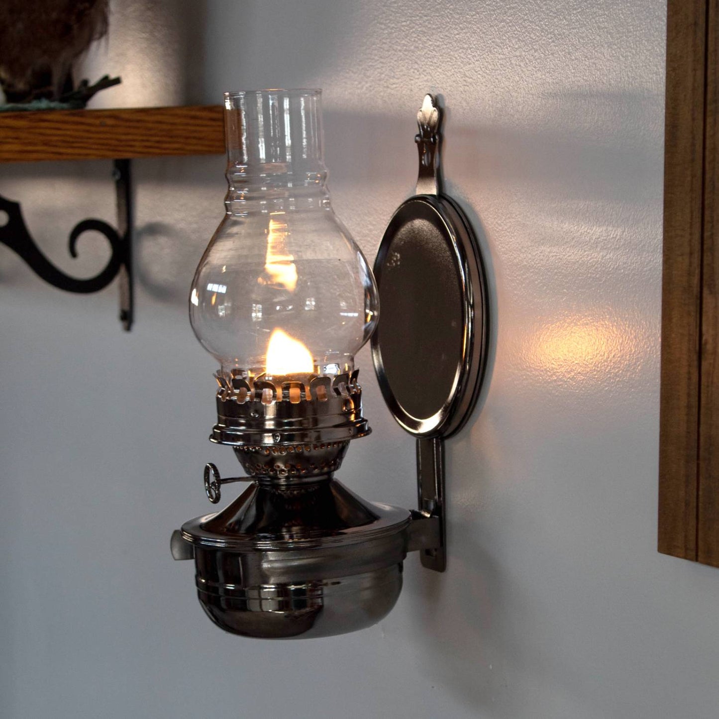 Lehman's exclusive wall-mounted oil lamp with painted pewter-like finish, clear ribbed glass chimney, and removable round reflector, ideal for cozy lighting in lamps & lighting and oil lamps collections.