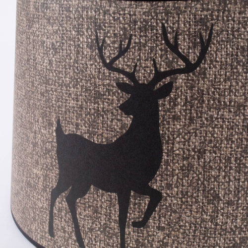 Close-up of a handcrafted parchment lamp shade in natural tones, featuring a woodland deer silhouette, part of Lamps & Lighting, Lamp Shades, and Parts and Accessories collections.