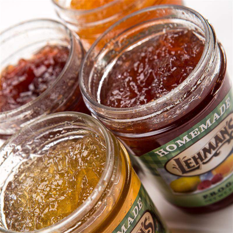 Close-up of handcrafted Lehman's jams, jellies, and fruit butters in glass jars, featuring all-natural ingredients, made in USA, perfect for Kitchen & Food and Pantry collections.