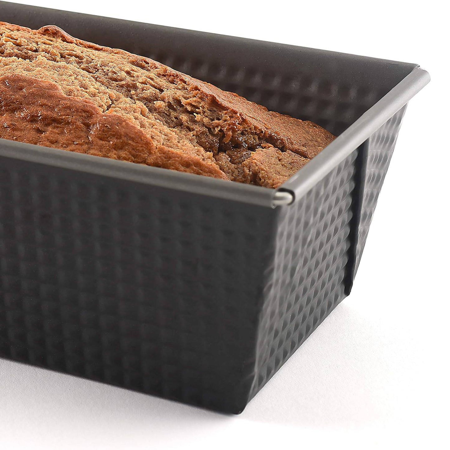 Heavy gauge steel loaf pan with durable nonstick coating, tapered sides, and textured surface for easy release, ideal for Kitchen & Food, Cookware, and Baking Supplies collections.