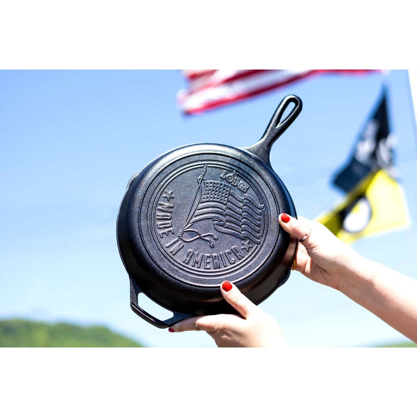 Handcrafted cast iron skillet featuring an embossed American flag and "Made in America" design, perfect for Kitchen & Food, Cookware, Cast Iron, USA Made, and Best Sellers collections.