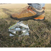 Sturdy metal mole trap set partially underground, demonstrating foot-activated spring mechanism, ideal for Farm, Garden & Tool, Pest Control, and USA Made collections.