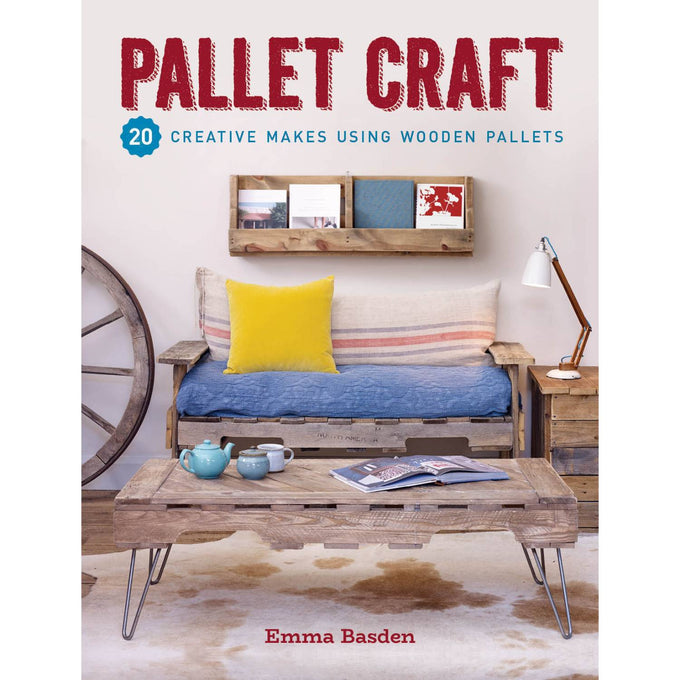 Cozy rustic living room featuring handmade wooden pallet furniture including a sofa with colorful cushions, a coffee table, and wall shelf, showcasing creative DIY home and garden ideas from a bestselling craft book.