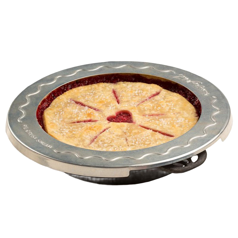 Round aluminum pie crust shield with scalloped edge placed on a pie to prevent crust burning, fits 10-inch pies, ideal for Kitchen & Food, Baking Supplies, and Cooking Helpers collections.