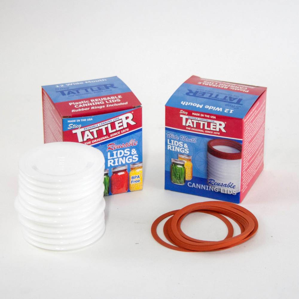 Two sealed boxes of reusable wide-mouth canning lids and rubber sealing rings, BPA-free and made in USA, ideal for kitchen food preservation and canning needs.