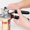 Hands using a sturdy metal can opener with rubberized black grips to easily open a canned food container, featured in Kitchen & Food, Kitchen Gadgets, and USA Made collections.