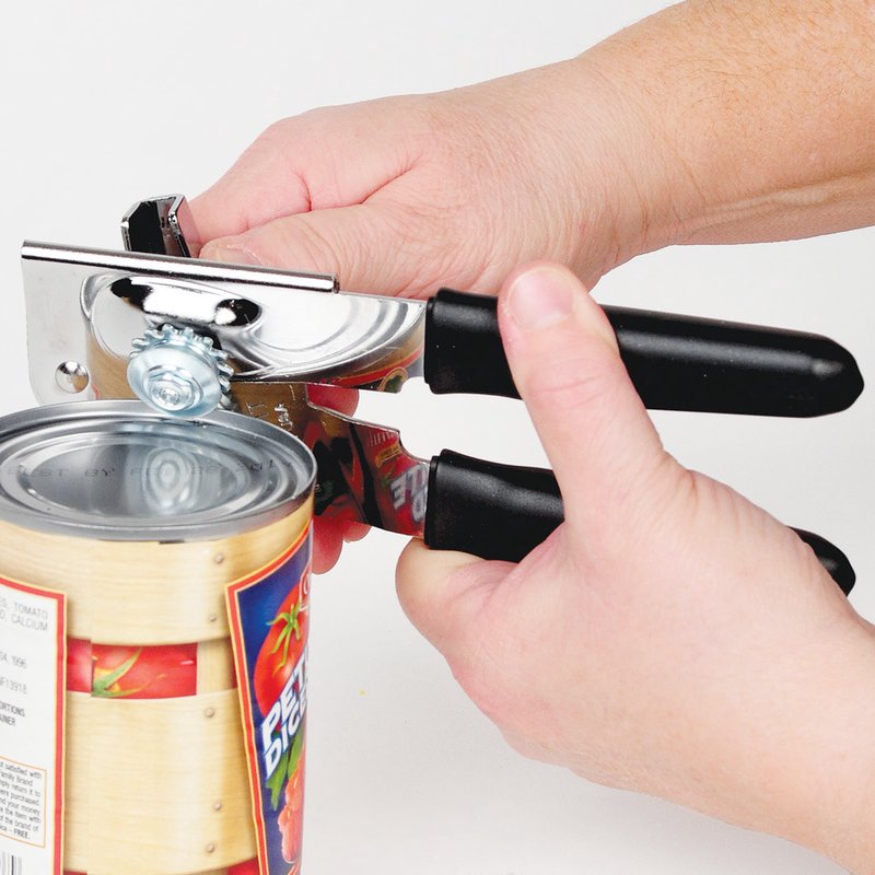 Hands using a sturdy metal can opener with rubberized black grips to easily open a canned food container, featured in Kitchen & Food, Kitchen Gadgets, and USA Made collections.