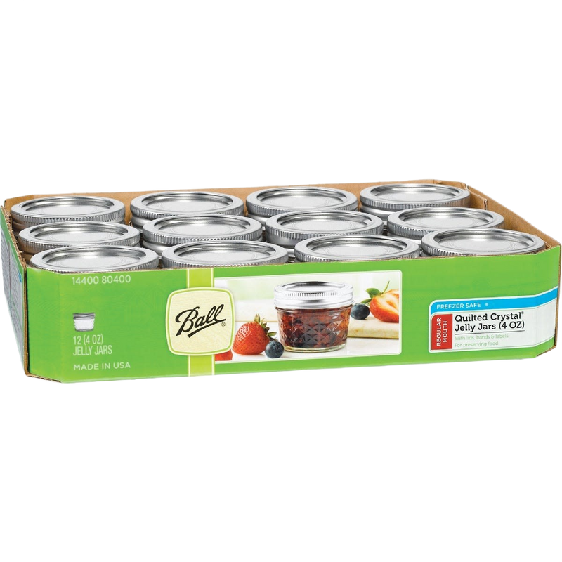 Set of 12 clear glass regular-mouth jelly jars with quilted texture and metal lids, perfect for food preservation, canning, and kitchen use, made in USA and promo eligible.