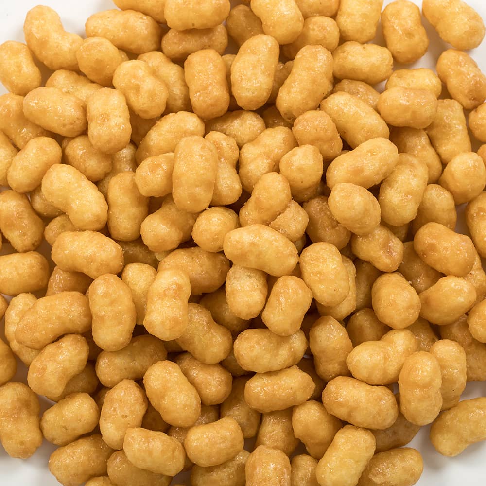Close-up of crunchy caramel-coated puffcorn pieces with a golden caramel glaze, a popular snack featured in Kitchen & Food, Snacks and Sweets, USA Made, and Best Sellers collections.