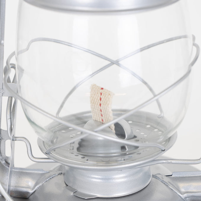 Close-up of the wick and clear glass globe on a handcrafted silver metal Rayo Redi-Lite Lantern with weather-resistant finish, perfect for Farm, Garden & Tool, Camping, and Emergency Supplies collections.