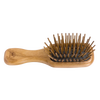 Handcrafted compact hairbrush with olive wood handle and seven rows of straight hornbeam pins for gentle detangling, featured in Health & Wellness, Grooming, and Best Sellers collections.