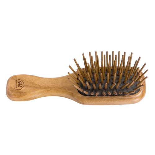 Handcrafted compact hairbrush with olive wood handle and seven rows of straight hornbeam pins for gentle detangling, featured in Health & Wellness, Grooming, and Best Sellers collections.