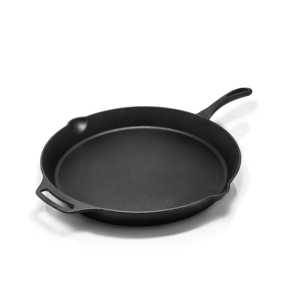 Durable cast iron fire skillet with long handle and helper grip, designed for versatile cooking indoors or outdoors, featured in Farm, Garden & Tool, Kitchen & Food, Camping, Cookware, Cast Iron, Best Sellers, and Promo Eligible collections.