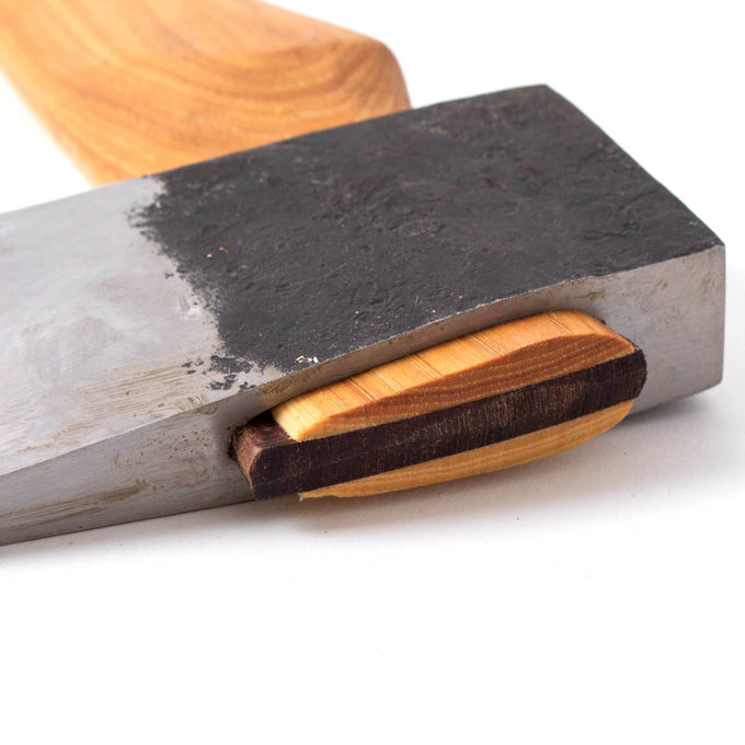 Close-up of a handcrafted axe head made from carbon steel with a visible texture and an Amish-made hickory handle, part of Farm, Garden & Tool and USA Made collections.