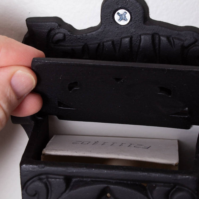 Handcrafted black wall-mounted matchbox holder made in USA, designed for convenient match storage, featured in Home & Decor, Household Helpers, USA Made, and Best Sellers collections.