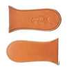 Two handcrafted vegetable-tanned leather skillet handle covers with embossed vintage wagon design, made in USA, ideal for Kitchen & Food, Cast Iron, and Cookware collections.