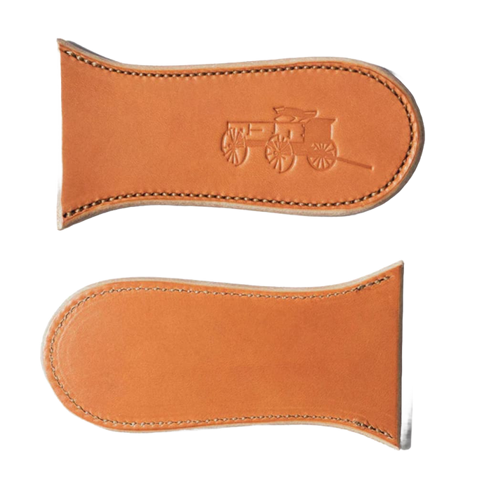 Two handcrafted vegetable-tanned leather skillet handle covers with embossed vintage wagon design, made in USA, ideal for Kitchen & Food, Cast Iron, and Cookware collections.