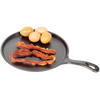 Handcrafted cast iron round griddle with a flat bottom holding three crispy bacon strips and four whole eggs, made in USA, ideal for Kitchen & Food, Cookware, Cast Iron, and Best Sellers collections.