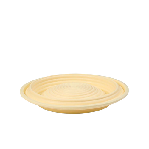 Light beige collapsible bread proofing basket with concentric grooves, crafted from silicone with steel rim for easy dough shaping and compact storage, ideal for Kitchen & Food and Baking Supplies collections.
