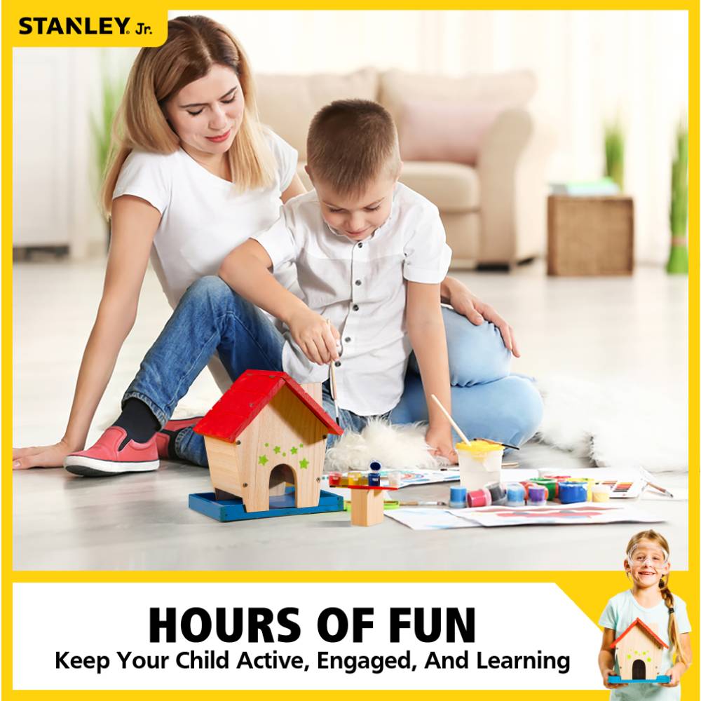 Mother and young boy sitting on floor indoors, painting and assembling a colorful wooden bird feeder kit, promoting creativity and learning in children's toys and arts and crafts collections.
