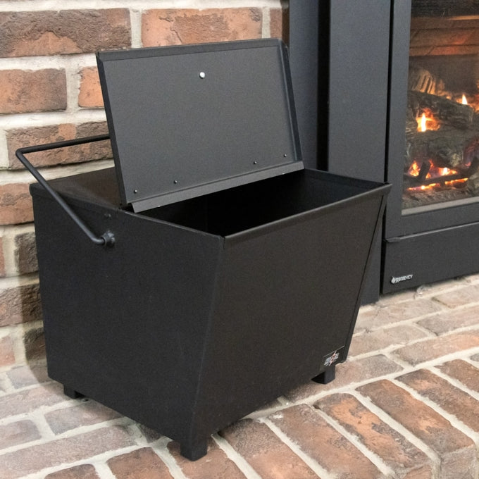 Heavy-duty steel ash carrier with hinged lid and balanced handle for safe ash cleanup, crafted in the USA, featured in Hearth Accessories, Stoves, and Best Sellers collections.
