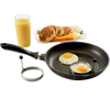 Set of two handcrafted stainless steel pancake rings with stay-cool handles shown with eggs cooking in a black nonstick frying pan, next to a plate of pancakes and glass of orange juice, ideal for Kitchen & Food, Kitchen Gadgets, Cooking and Baking Helpers, Best Sellers, Promo Eligible collections.