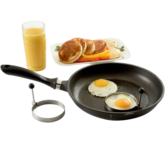 Set of two handcrafted stainless steel pancake rings with stay-cool handles shown with eggs cooking in a black nonstick frying pan, next to a plate of pancakes and glass of orange juice, ideal for Kitchen & Food, Kitchen Gadgets, Cooking and Baking Helpers, Best Sellers, Promo Eligible collections.