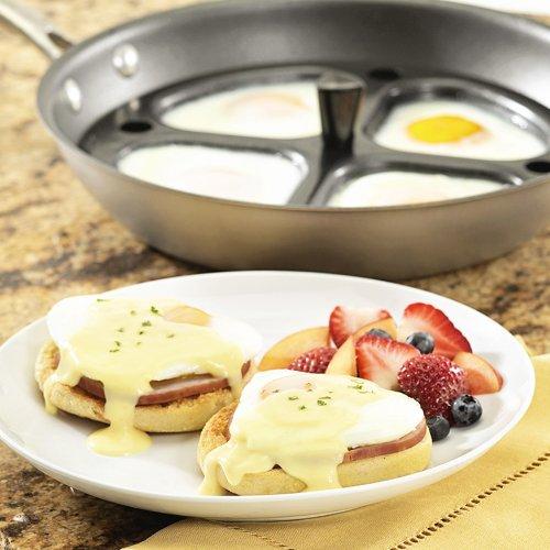 Non-stick aluminum egg poacher pan with plastic handle containing cooked eggs, shown with plated Eggs Benedict and fresh fruit, fitting Kitchen & Food, USA Made, and Best Sellers collections.
