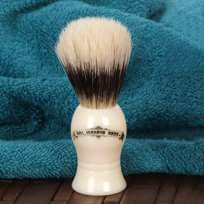 Creamy white and black-tipped boar hair shaving brush with smooth glossy handle, featured in Health & Wellness, Grooming and Personal Hygiene, Best Sellers, and Promo Eligible collections.