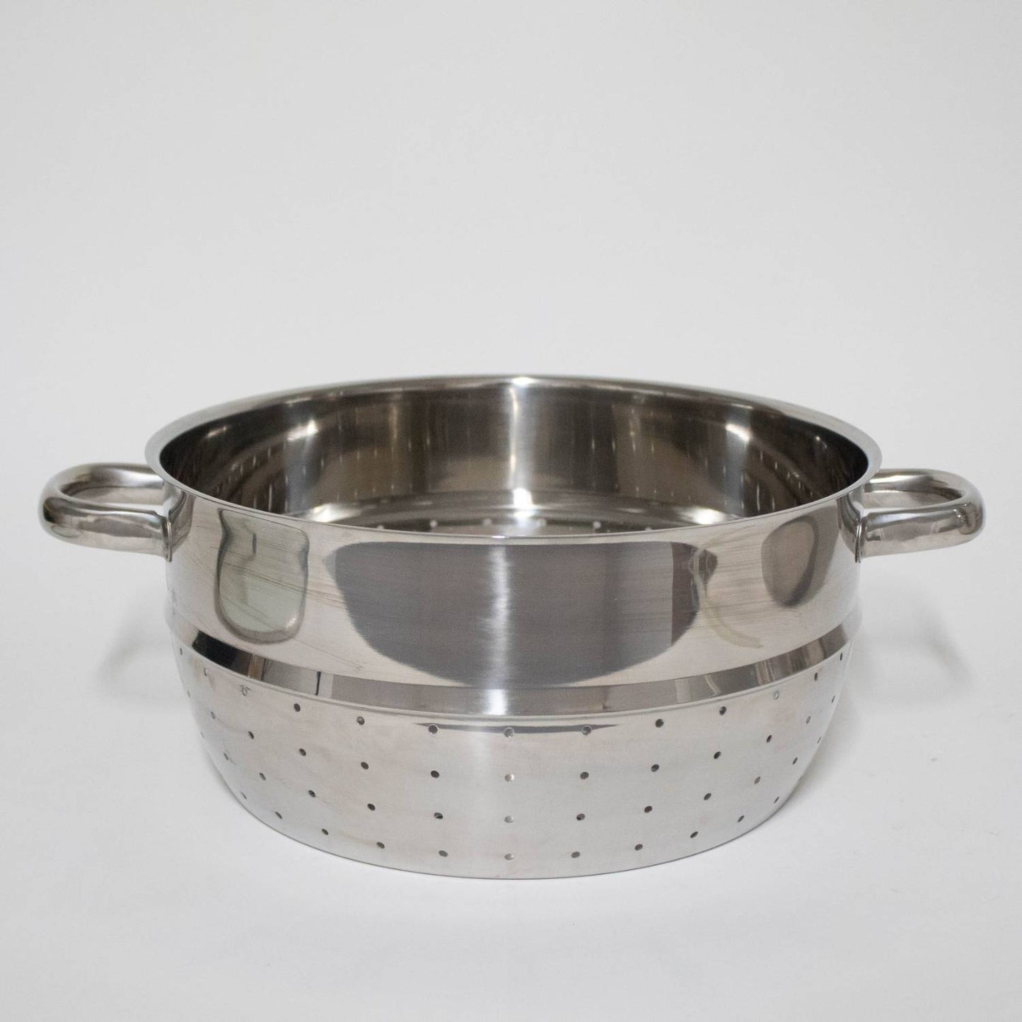 Polished stainless steel perforated fruit basket insert with side handles, designed for use with stovetop juicers in Kitchen & Food, Juicers and Steamers, Best Sellers, and Promo Eligible collections.