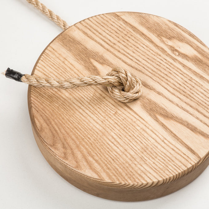 Handcrafted round wooden tree swing seat made in USA with durable natural rope knot, perfect for outdoor play and included in Toys, Books & Games and Children's Toys collections.