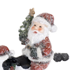 Charming handcrafted resin Santa figurine holding a Christmas tree, surrounded by snow accents, adding festive cheer to Home & Decor, Holiday Decor, Best Sellers, and Promo Eligible collections.