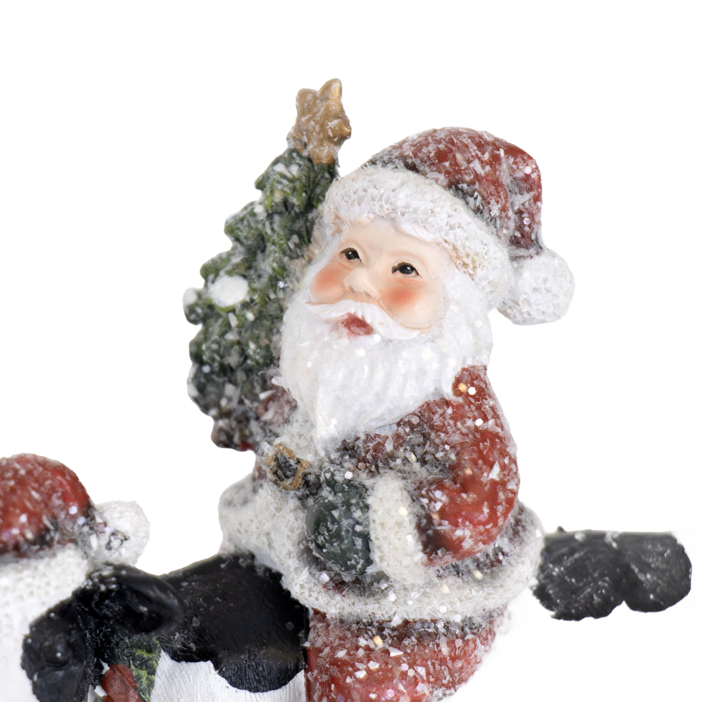 Charming handcrafted resin Santa figurine holding a Christmas tree, surrounded by snow accents, adding festive cheer to Home & Decor, Holiday Decor, Best Sellers, and Promo Eligible collections.