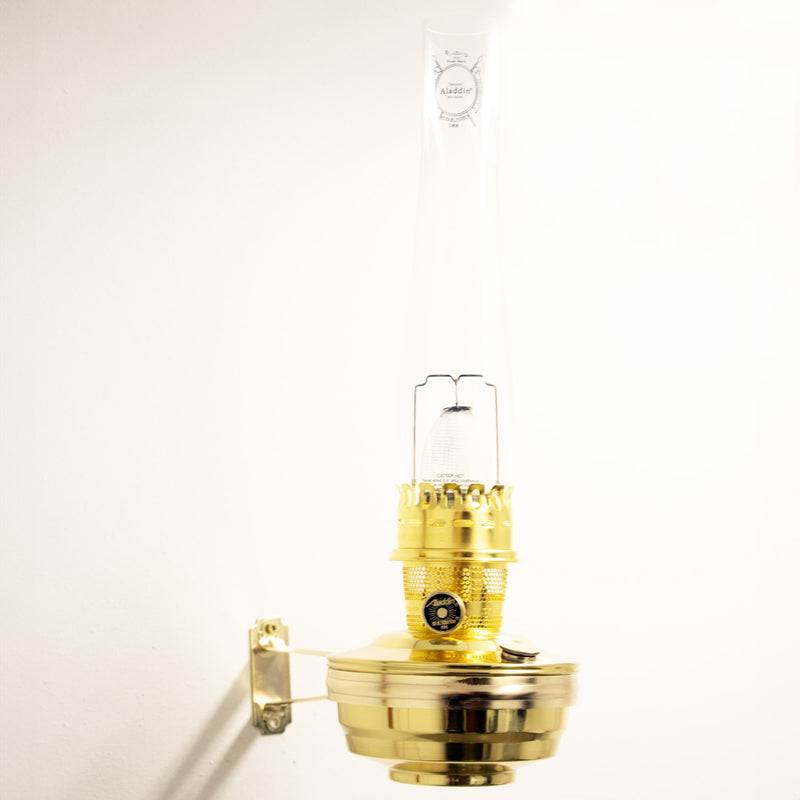 Handcrafted solid brass wall-mounted oil lamp with clear glass chimney, designed for bright, reliable light in farm, garden, emergency, and lamps & lighting collections.