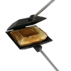 Cast iron square pie iron with metal handle and wooden grips, toasting a sandwich, ideal for camping and included in Farm, Garden & Tool, Best Sellers, and Promo Eligible collections.