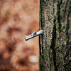 Close-up of a metal spile inserted into the bark of a maple tree, dripping sap, part of maple syrup sugaring supplies in Farm, Garden & Tool and Orchard collections.