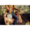 Handcrafted cast iron square grill pan with seasoned ribs, held in a leather bag by a rider wearing gloves and casual outdoor clothing, set on a horseback in a natural landscape, ideal for Kitchen & Food, Cookware, Cast Iron, and USA Made collections.