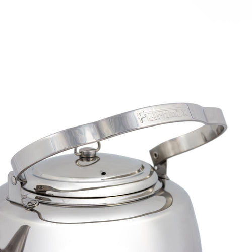 Close-up of the polished stainless steel kettles movable threefold bent handle with embossed branding, designed for hanging and ease of use, ideal for Farm, Garden & Tool, Kitchen & Food, Camping, Brewing Coffee and Tea, Best Sellers, and Promo Eligible collections.