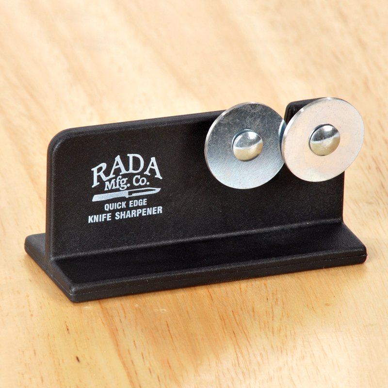Compact knife sharpener with reinforced nylon base and dual polished metal sharpening wheels, handcrafted in the USA, ideal for kitchen, farm, and food prep use.