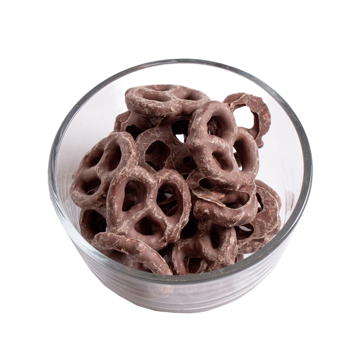 Clear glass bowl filled with handcrafted chocolate coated pretzels in milk chocolate, a USA made snack ideal for Kitchen & Food, Snacks and Sweets, Candy, Best Sellers, and Promo Eligible collections.