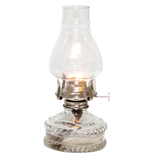 Clear glass oil lamp with a bright flame, featuring a decorative base and standard burner, ideal for emergency lighting and farm, garden, and tool use.