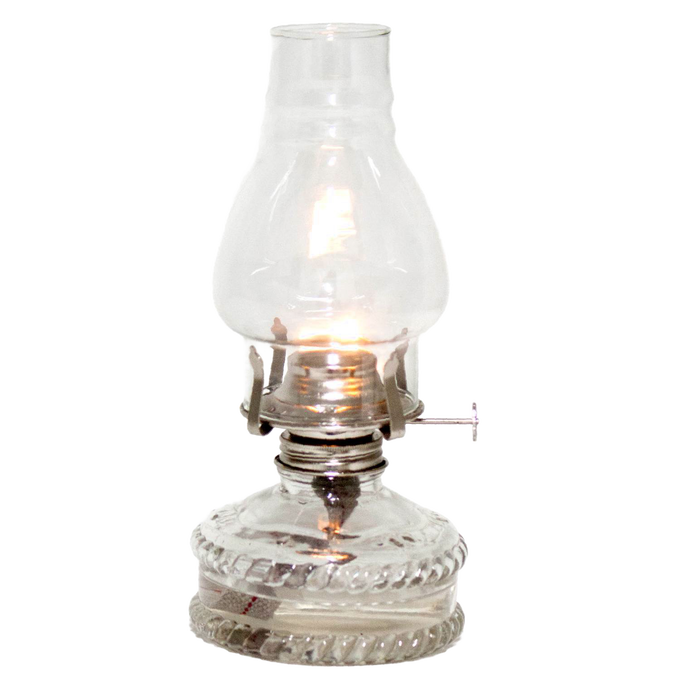 Clear glass oil lamp with a bright flame, featuring a decorative base and standard burner, ideal for emergency lighting and farm, garden, and tool use.