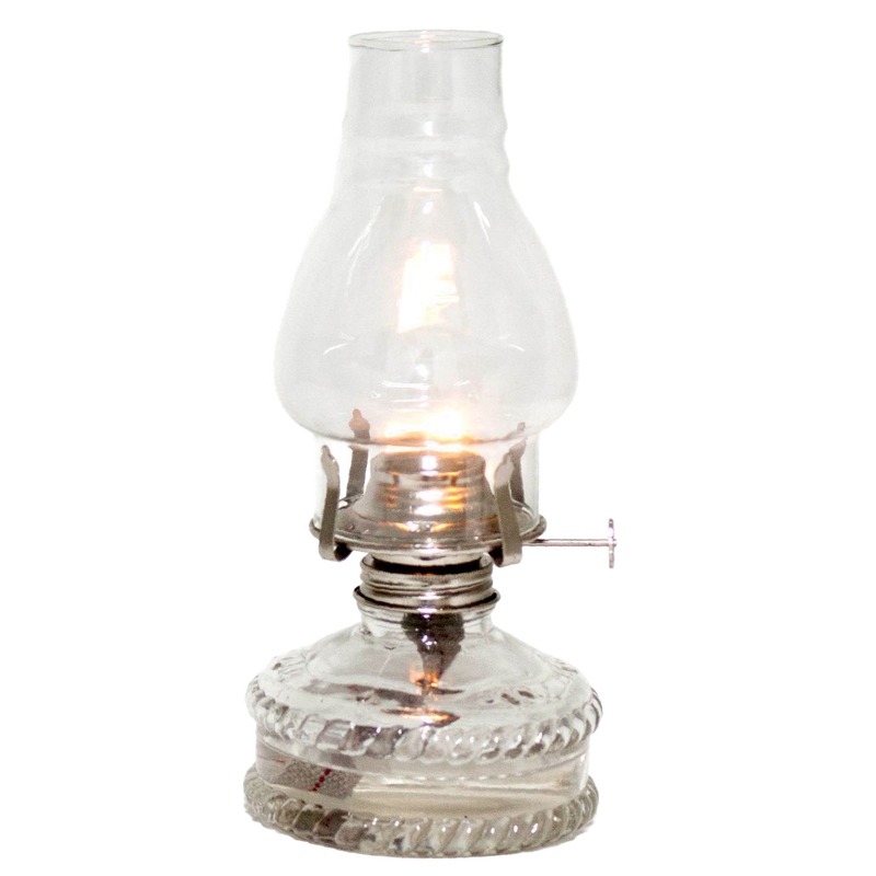 Clear glass oil lamp with a bright flame, featuring a decorative base and standard burner, ideal for emergency lighting and farm, garden, and tool use.