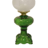 Handcrafted green glass oil lamp with intricately sculptured base and heavy brass-plated burner, topped with etched frosted glass chimney, ideal for Lamps & Lighting, Oil Lamps, Table Lamps, Best Sellers, and Promo Eligible collections.