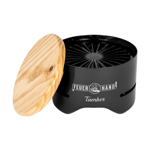 Compact black tabletop charcoal grill with a handcrafted wooden lid engraved with logo, designed for small outdoor cooking in Farm, Garden & Tool and Camping collections.